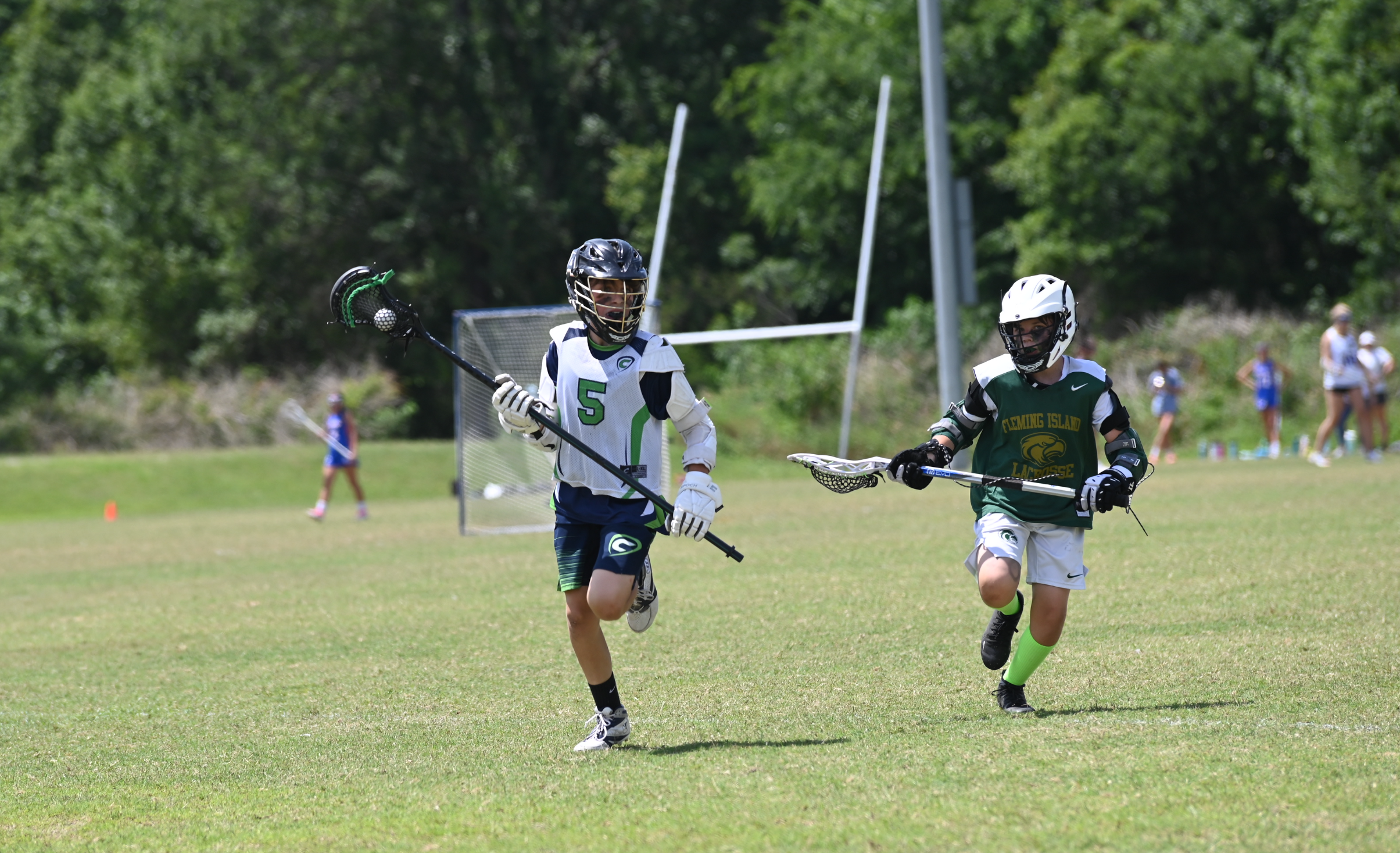 Jackson Kalaher, #5, takes the ball down the field against Fleming Island.